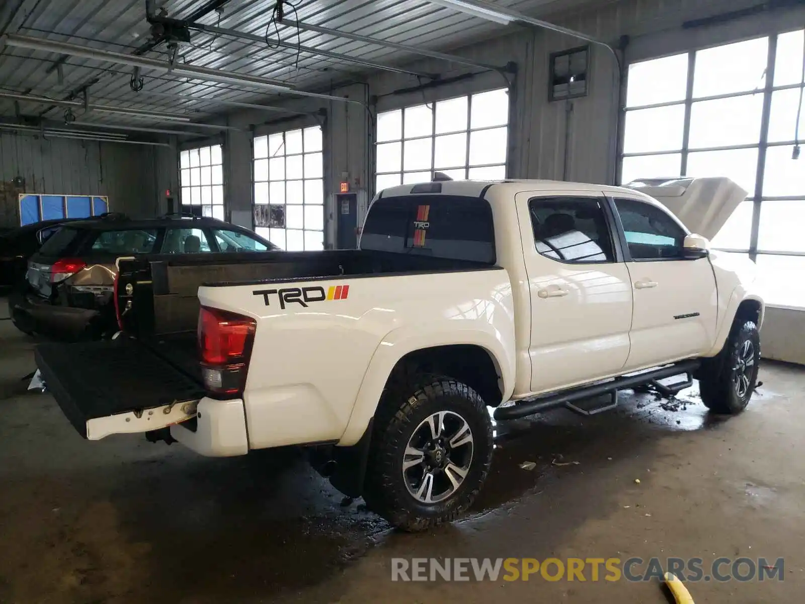 4 Photograph of a damaged car 3TMCZ5AN6KM238042 TOYOTA TACOMA 2019