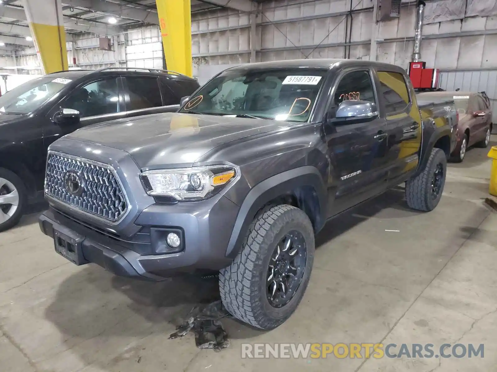 2 Photograph of a damaged car 3TMCZ5AN6KM251440 TOYOTA TACOMA 2019