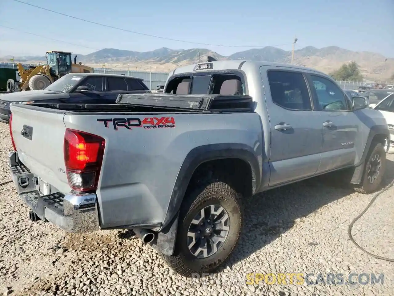 4 Photograph of a damaged car 3TMCZ5AN6KM256038 TOYOTA TACOMA 2019