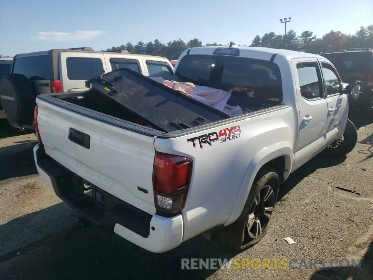 4 Photograph of a damaged car 3TMCZ5AN7KM242455 TOYOTA TACOMA 2019