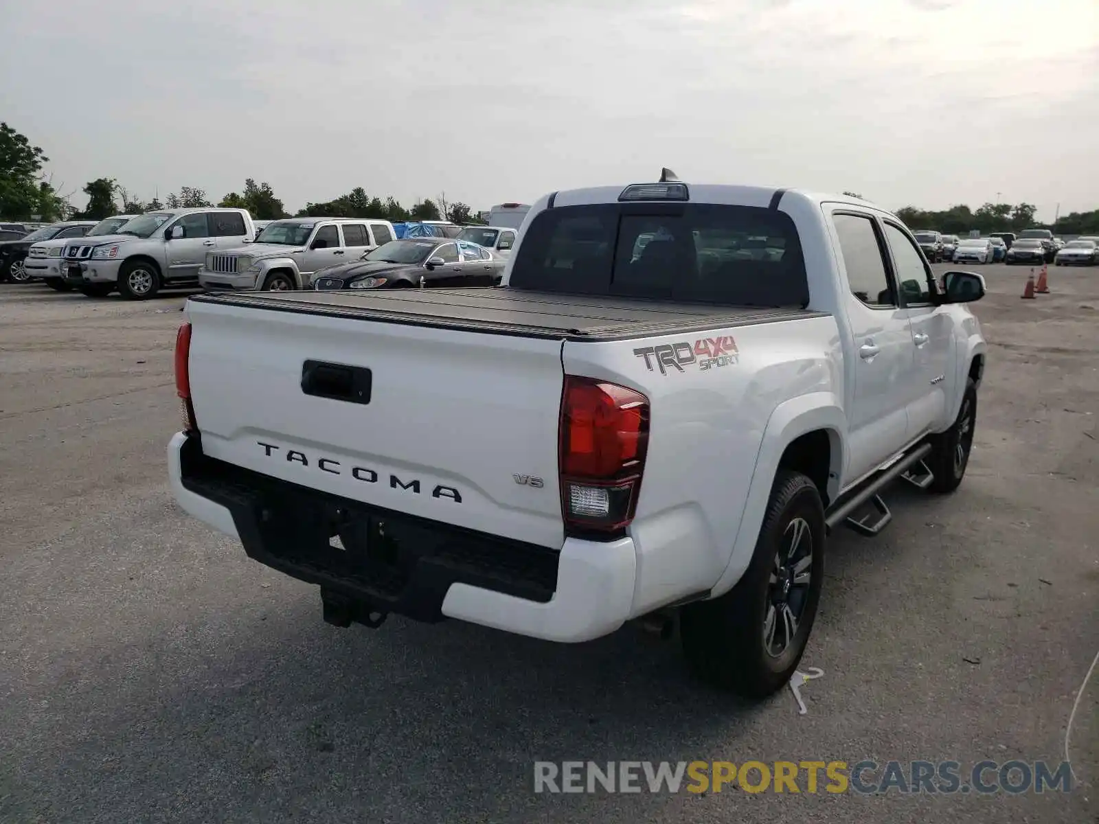 4 Photograph of a damaged car 3TMCZ5AN8KM205771 TOYOTA TACOMA 2019