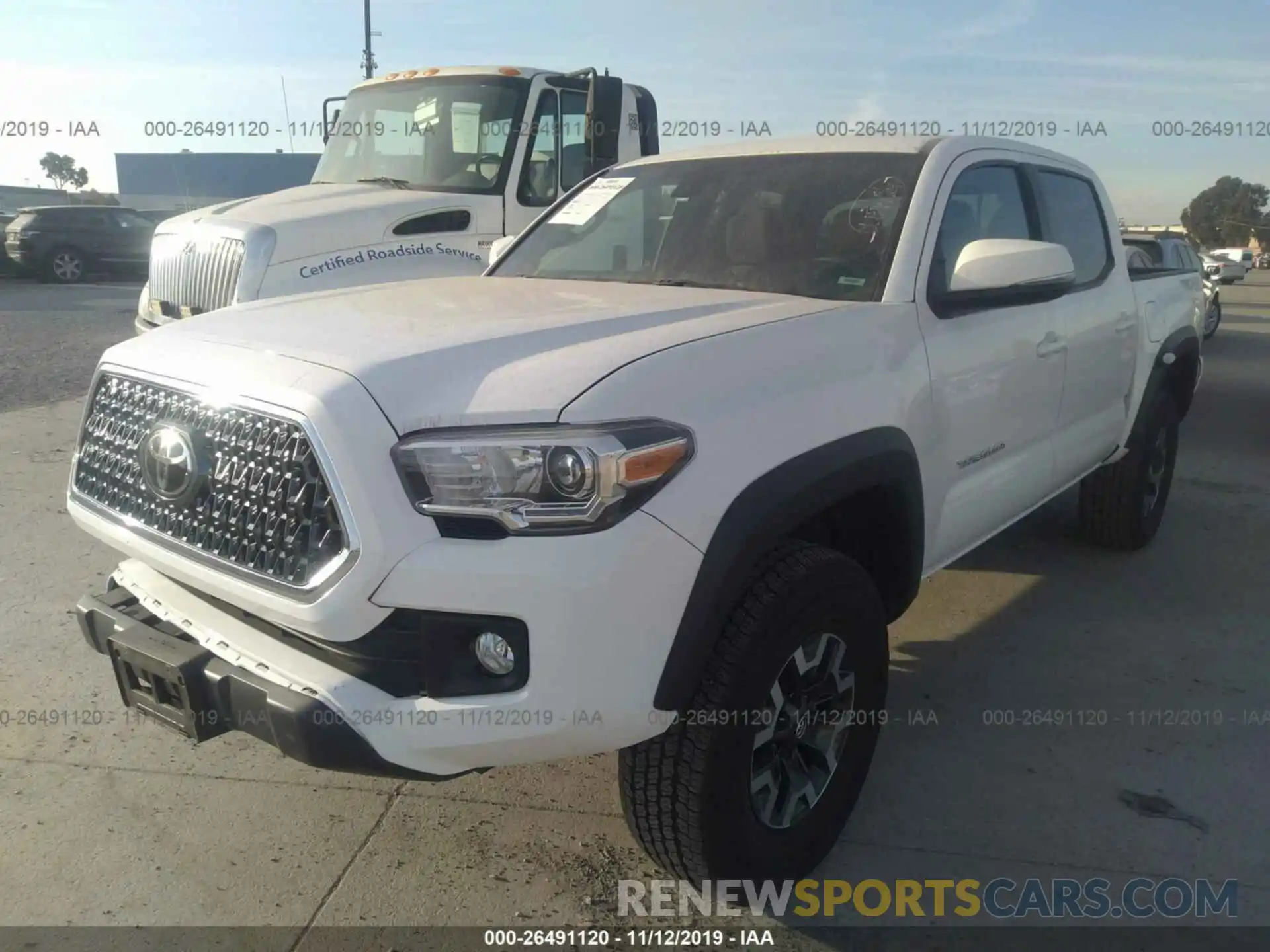 2 Photograph of a damaged car 3TMCZ5AN8KM259488 TOYOTA TACOMA 2019