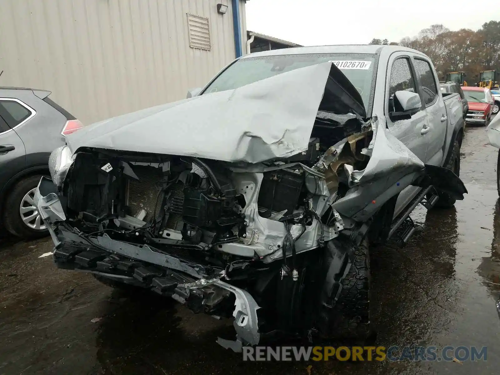 2 Photograph of a damaged car 3TMCZ5AN9KM230744 TOYOTA TACOMA 2019