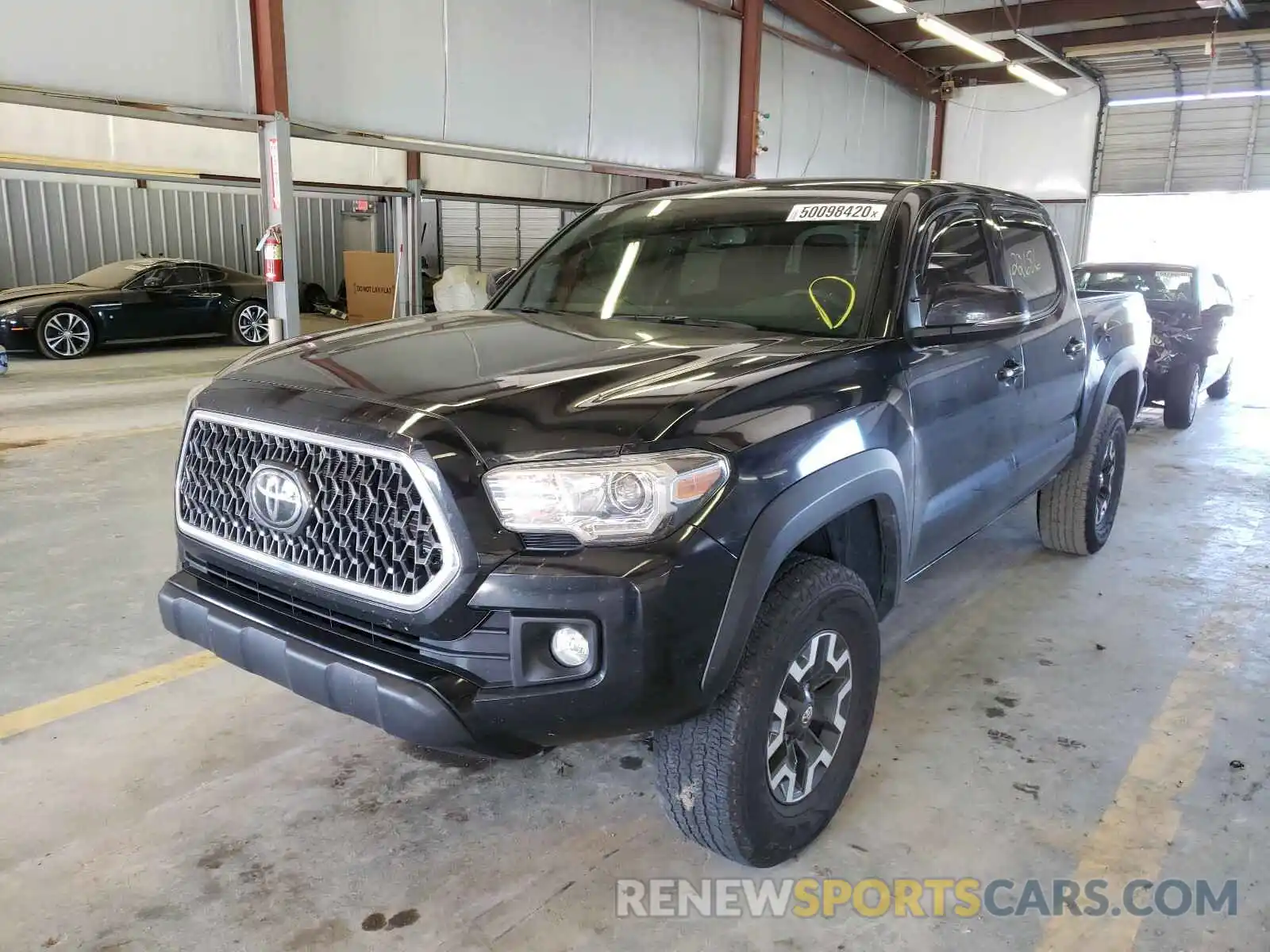 2 Photograph of a damaged car 3TMCZ5AN9KM275652 TOYOTA TACOMA 2019