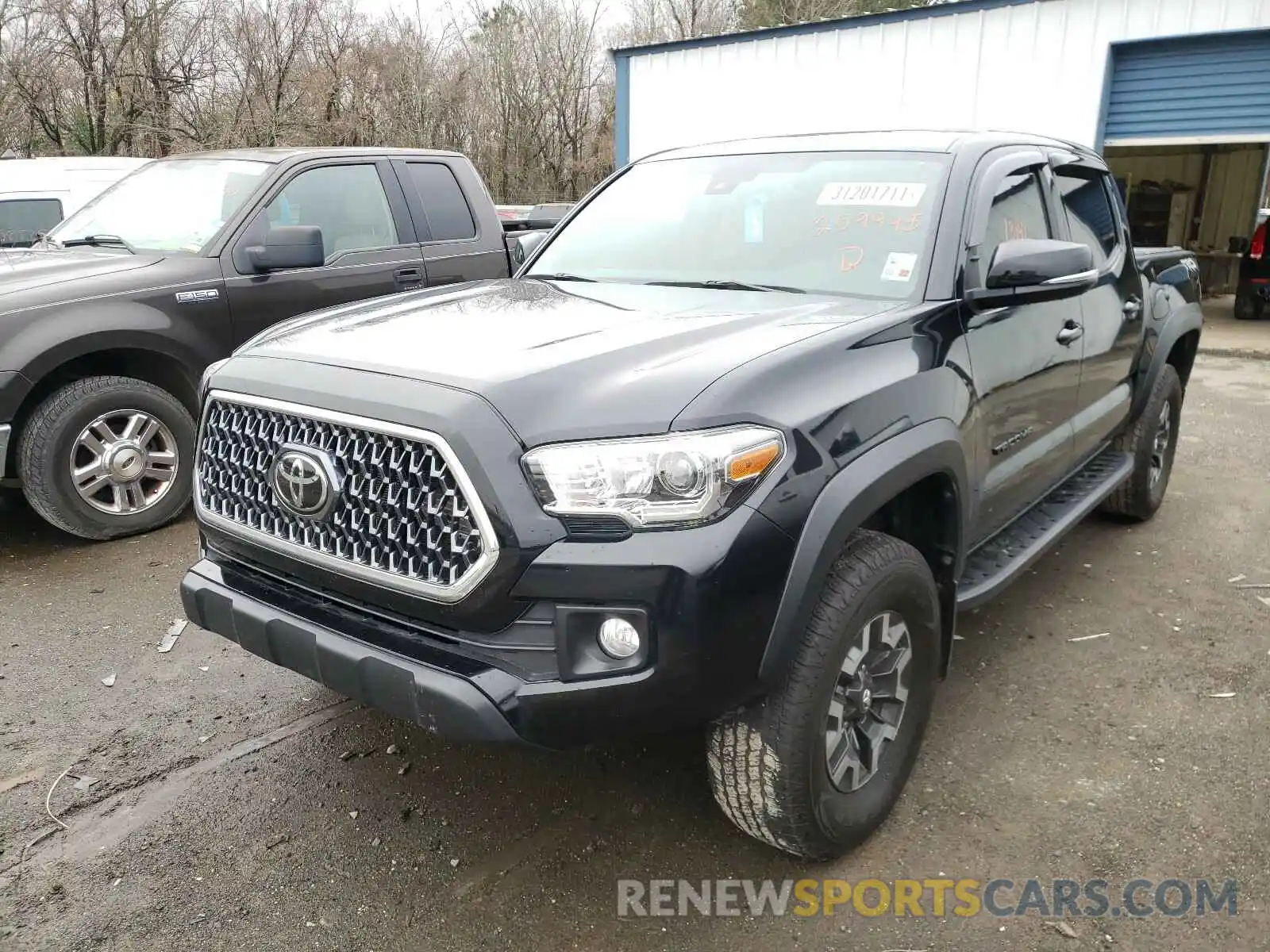 2 Photograph of a damaged car 3TMCZ5ANXKM259945 TOYOTA TACOMA 2019