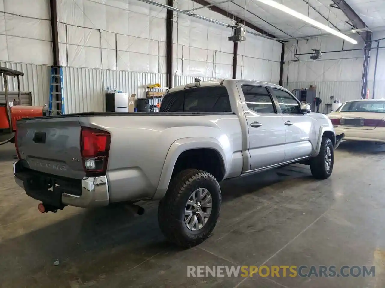 4 Photograph of a damaged car 3TMDZ5BN0KM061233 TOYOTA TACOMA 2019