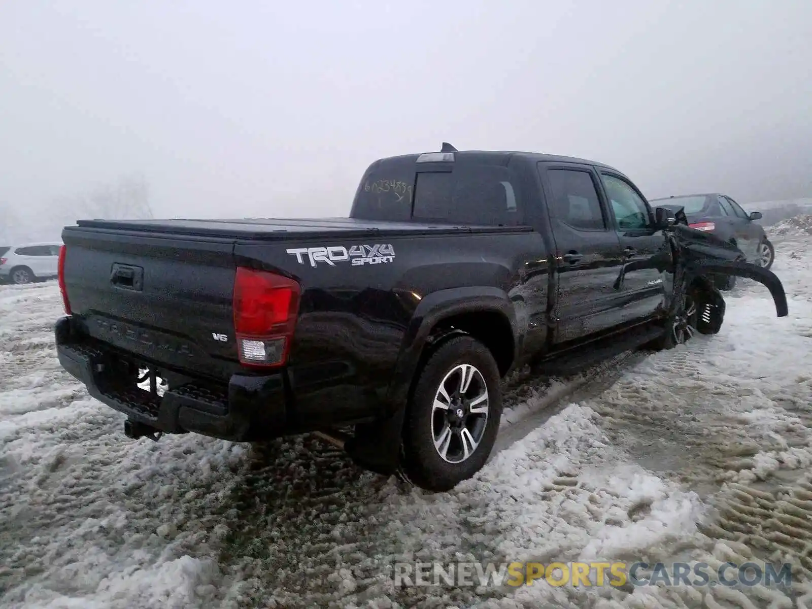 4 Photograph of a damaged car 3TMDZ5BN0KM068957 TOYOTA TACOMA 2019