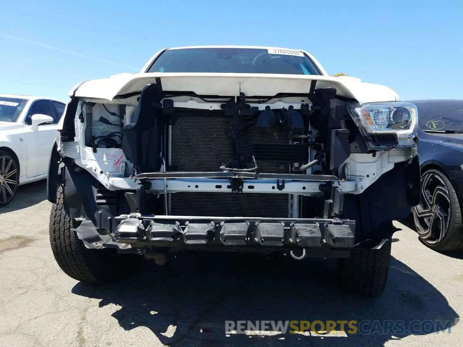 9 Photograph of a damaged car 3TMDZ5BN9KM058850 TOYOTA TACOMA 2019