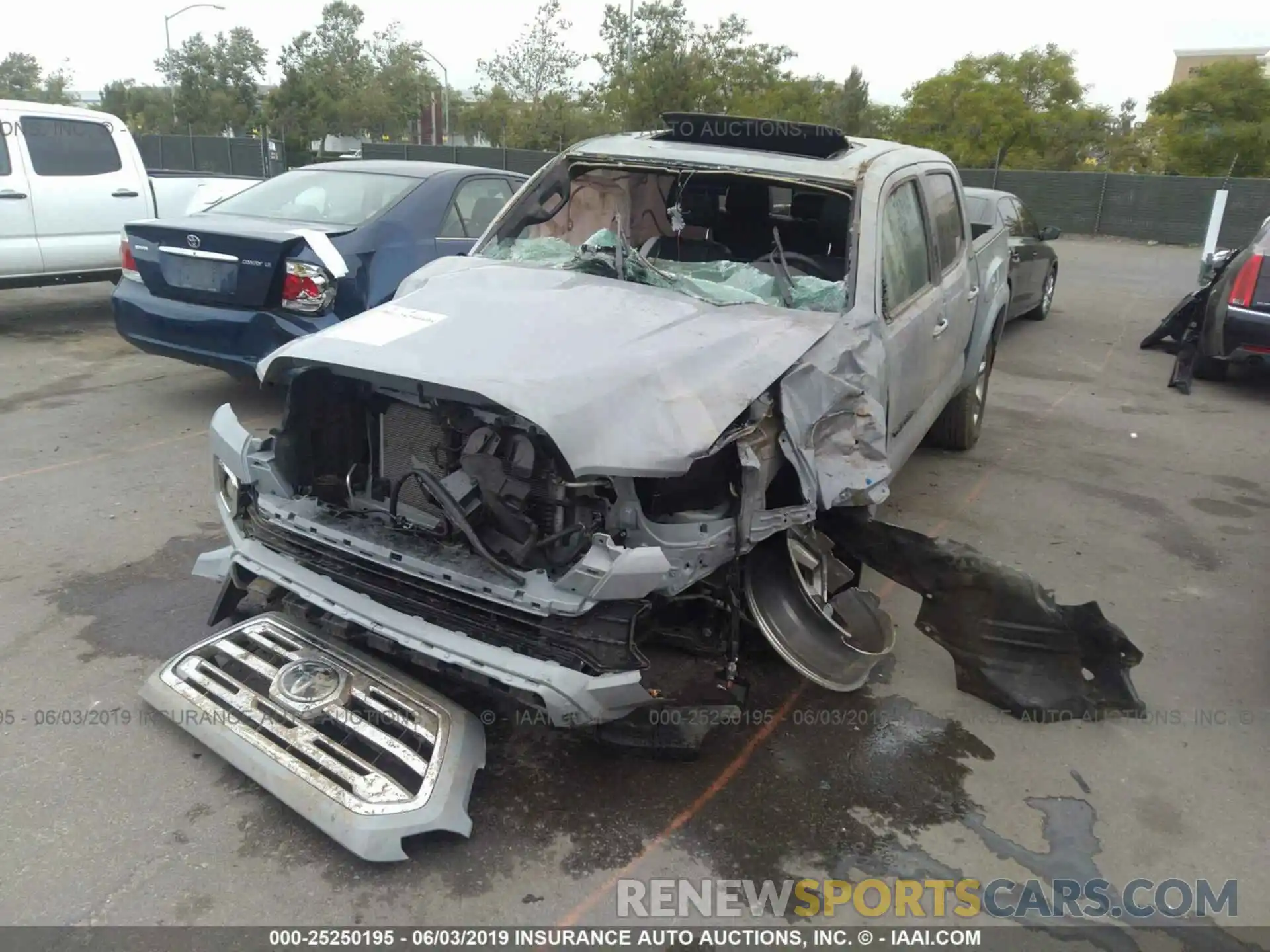 2 Photograph of a damaged car 3TMGZ5AN4KM222794 TOYOTA TACOMA 2019