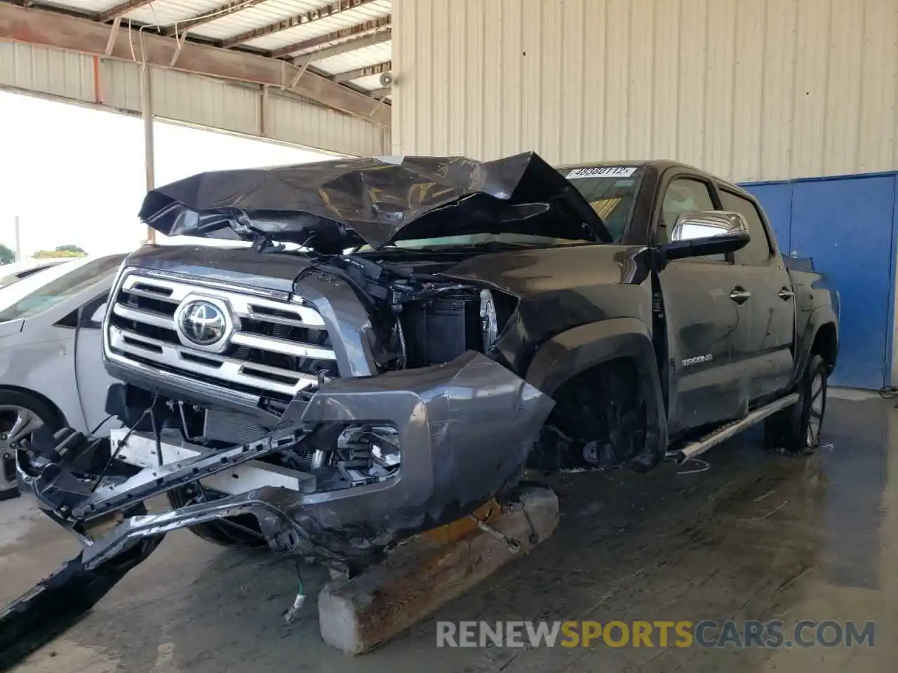 2 Photograph of a damaged car 3TMGZ5AN6KM249723 TOYOTA TACOMA 2019