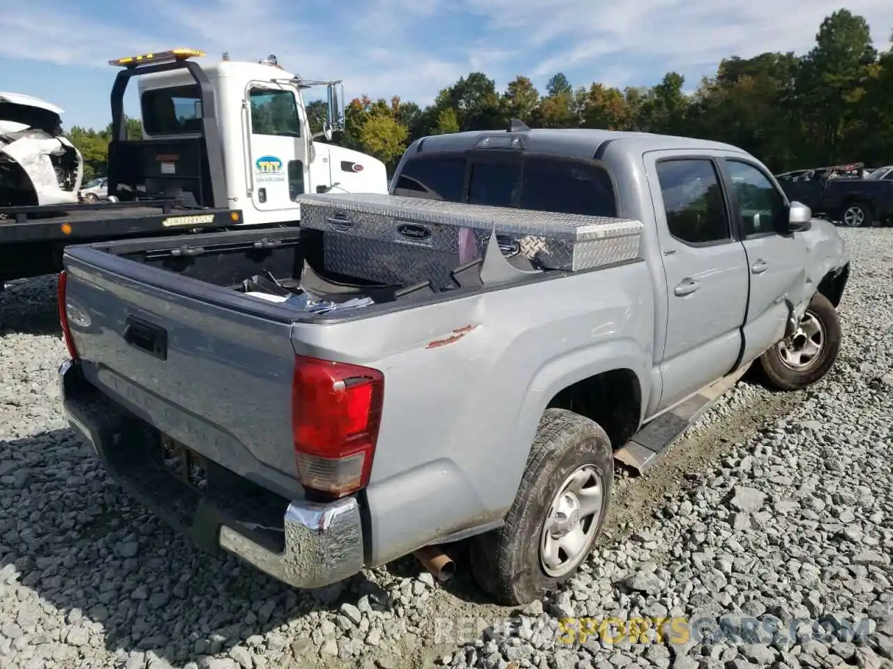 4 Photograph of a damaged car 5TFAX5GN1KX141250 TOYOTA TACOMA 2019