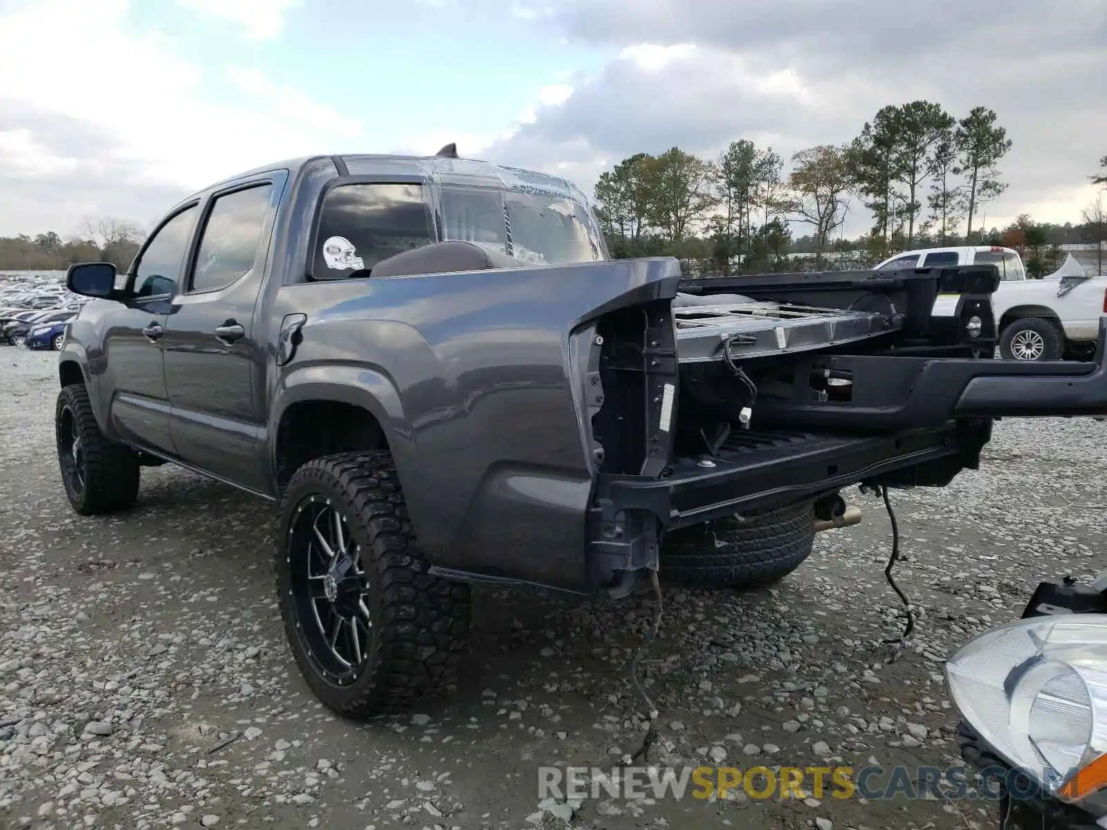 3 Photograph of a damaged car 5TFAX5GN1KX142706 TOYOTA TACOMA 2019