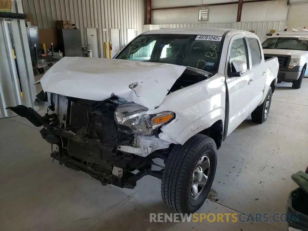 2 Photograph of a damaged car 5TFAX5GN3KX144005 TOYOTA TACOMA 2019