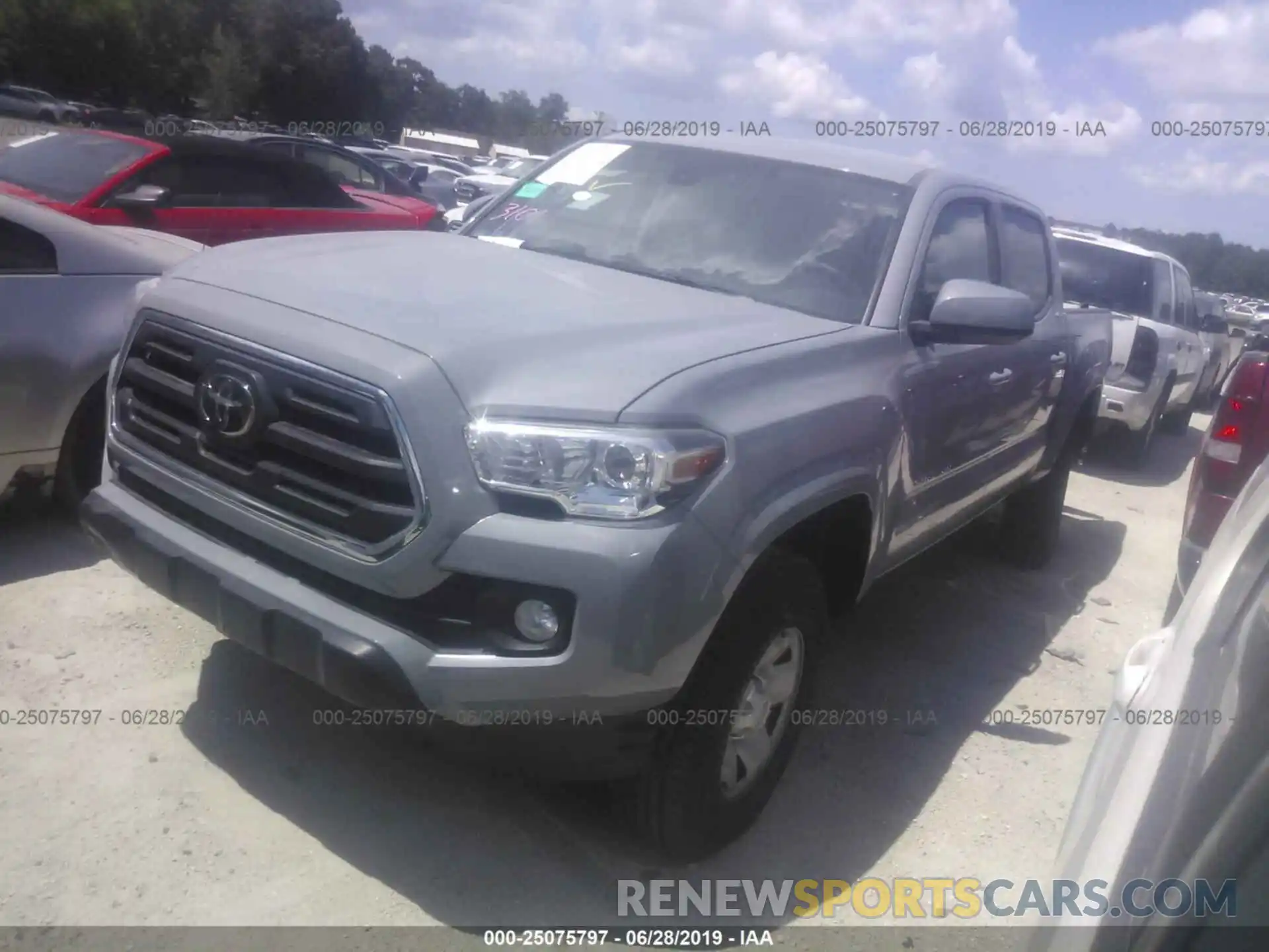 2 Photograph of a damaged car 5TFAX5GN4KX143543 TOYOTA TACOMA 2019