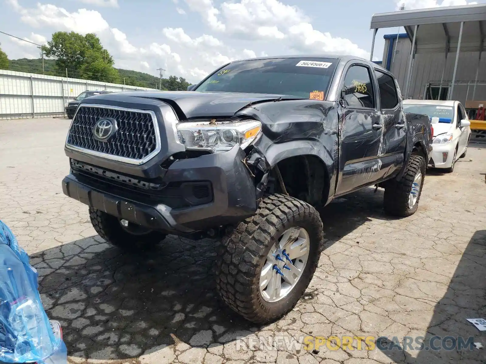 2 Photograph of a damaged car 5TFAX5GN6KX141924 TOYOTA TACOMA 2019