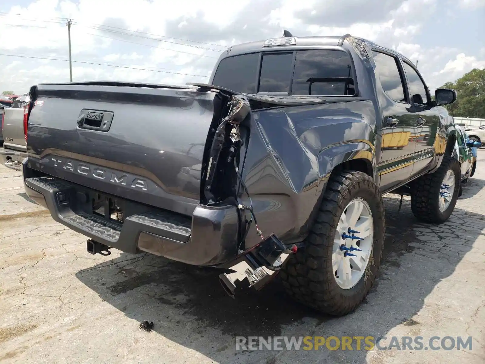 4 Photograph of a damaged car 5TFAX5GN6KX141924 TOYOTA TACOMA 2019