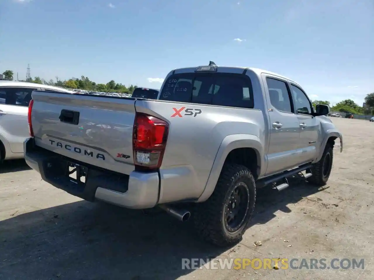 4 Photograph of a damaged car 5TFAX5GN7KX138269 TOYOTA TACOMA 2019