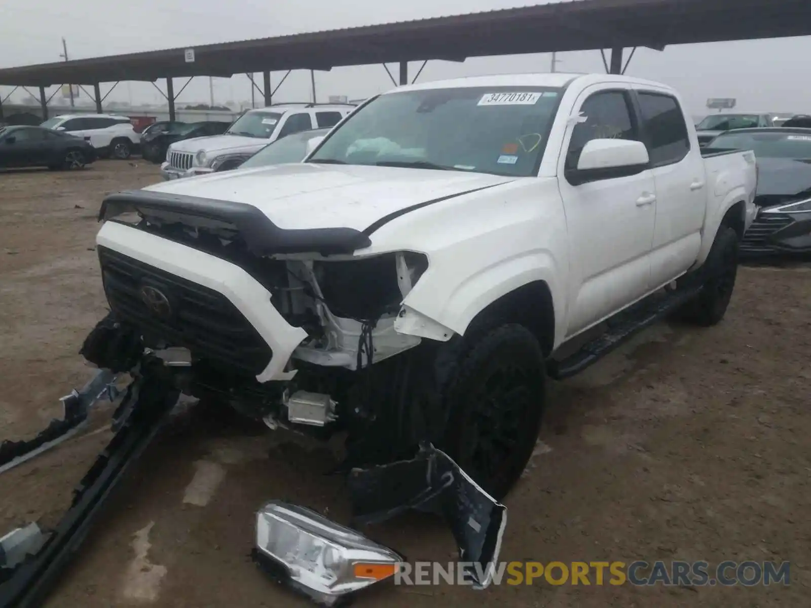 2 Photograph of a damaged car 5TFAX5GN7KX138496 TOYOTA TACOMA 2019