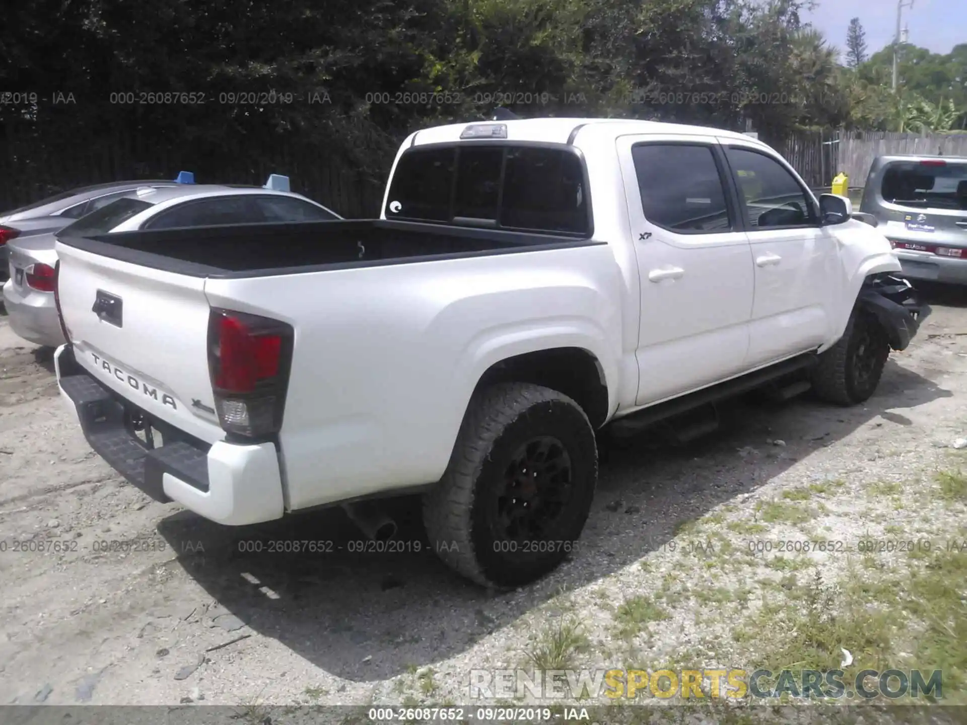 4 Photograph of a damaged car 5TFAX5GN7KX141270 TOYOTA TACOMA 2019