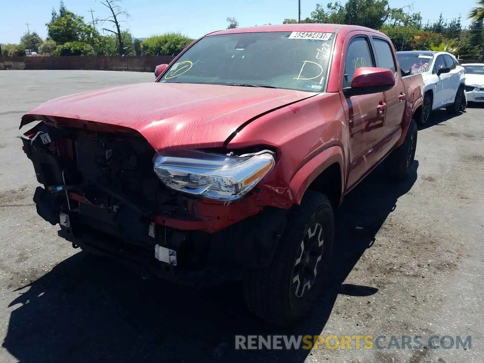 2 Photograph of a damaged car 5TFAX5GN8KX140273 TOYOTA TACOMA 2019