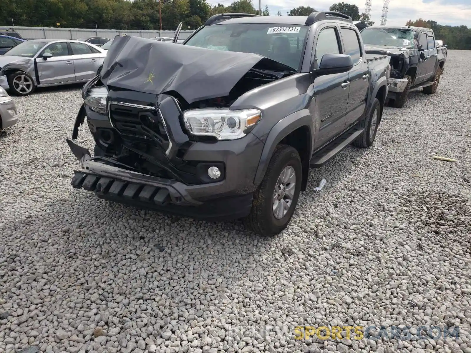 2 Photograph of a damaged car 5TFAX5GN8KX141844 TOYOTA TACOMA 2019