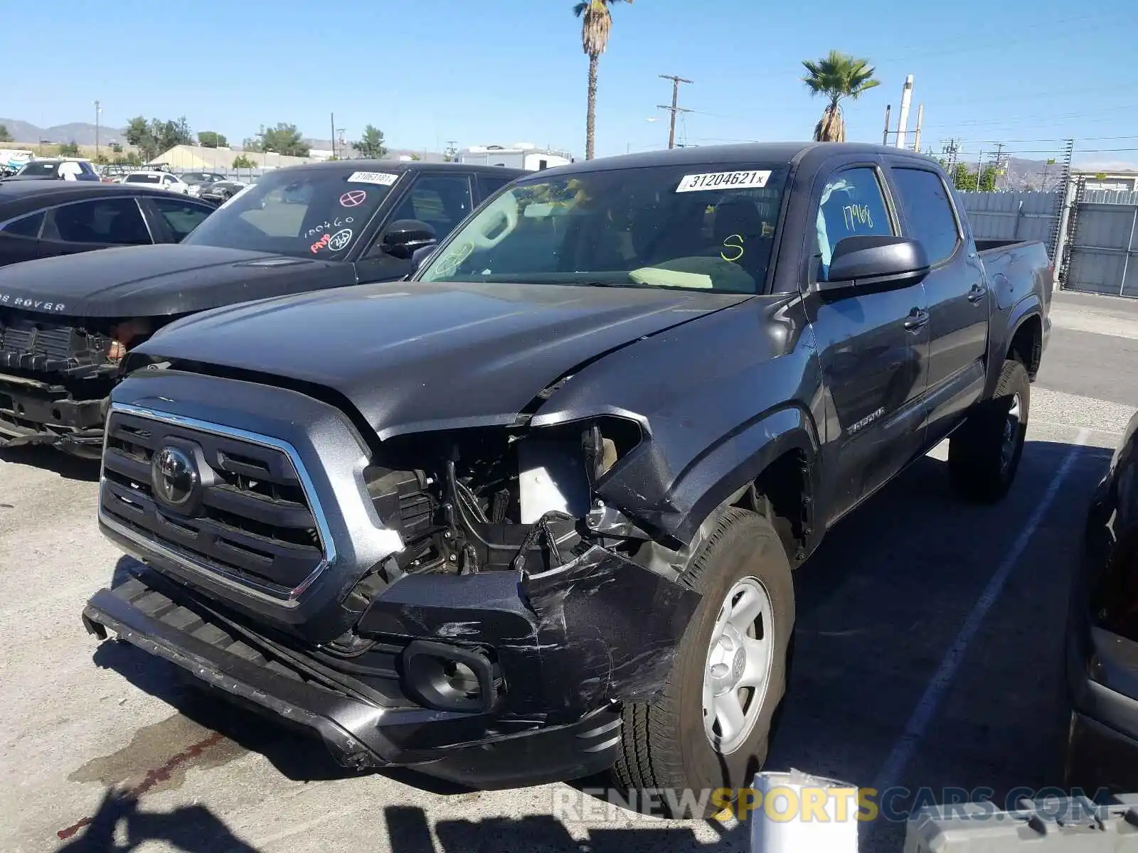 2 Photograph of a damaged car 5TFAX5GN8KX163925 TOYOTA TACOMA 2019