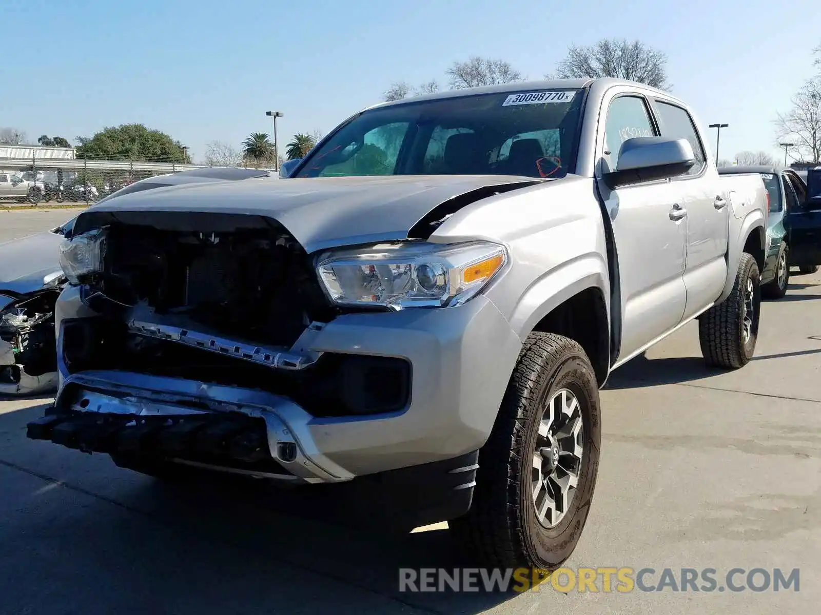 2 Photograph of a damaged car 5TFAX5GN9KX135261 TOYOTA TACOMA 2019