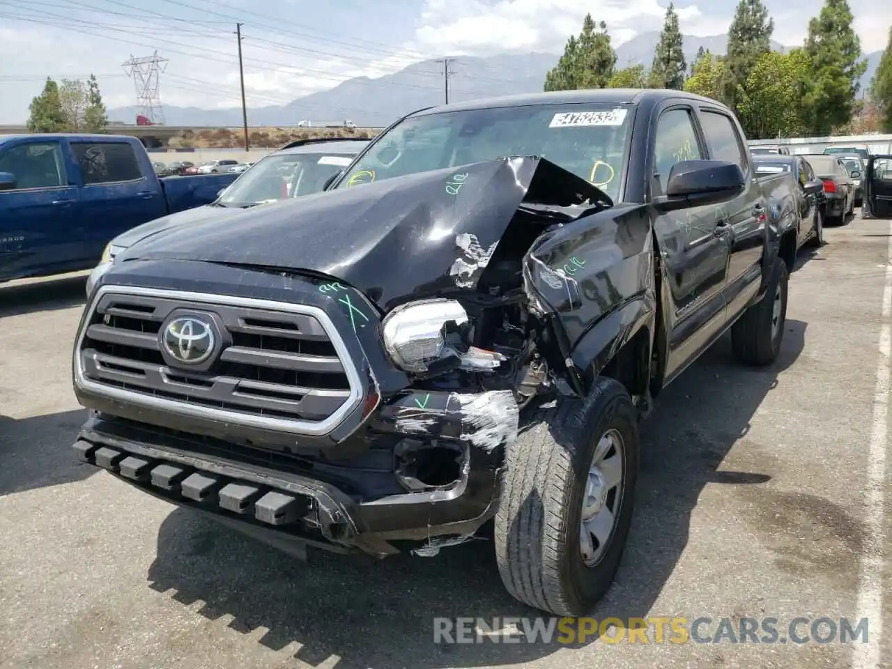 2 Photograph of a damaged car 5TFAX5GN9KX136751 TOYOTA TACOMA 2019