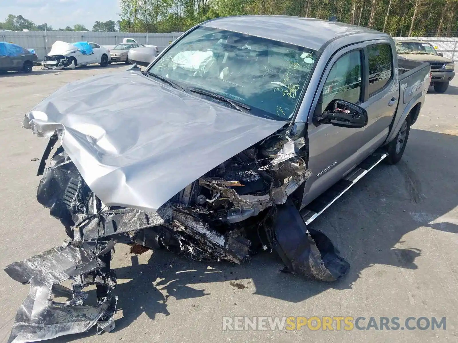 2 Photograph of a damaged car 5TFAX5GN9KX141898 TOYOTA TACOMA 2019