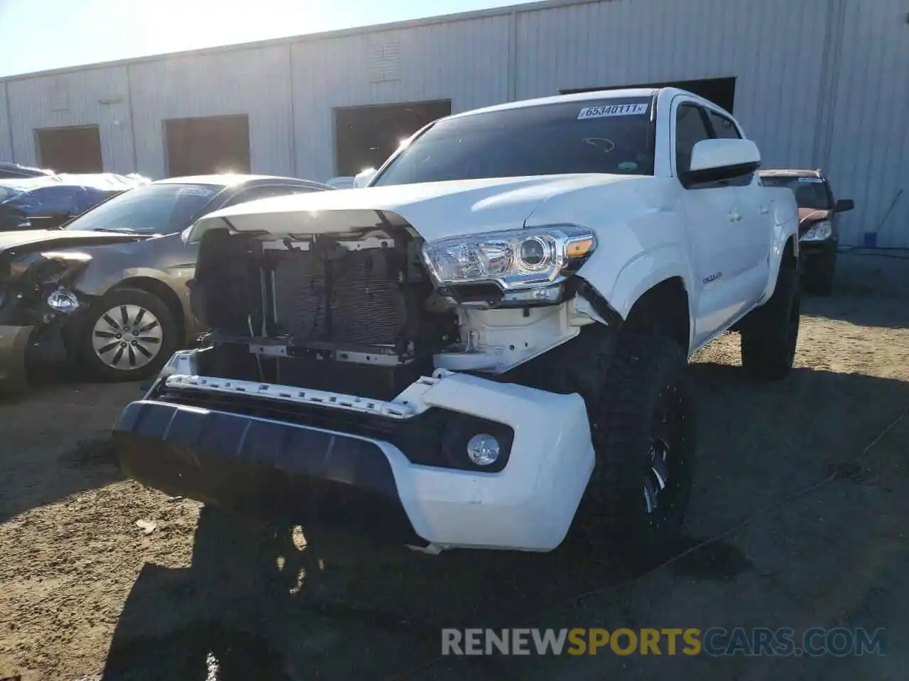 2 Photograph of a damaged car 5TFAX5GNXKX142803 TOYOTA TACOMA 2019