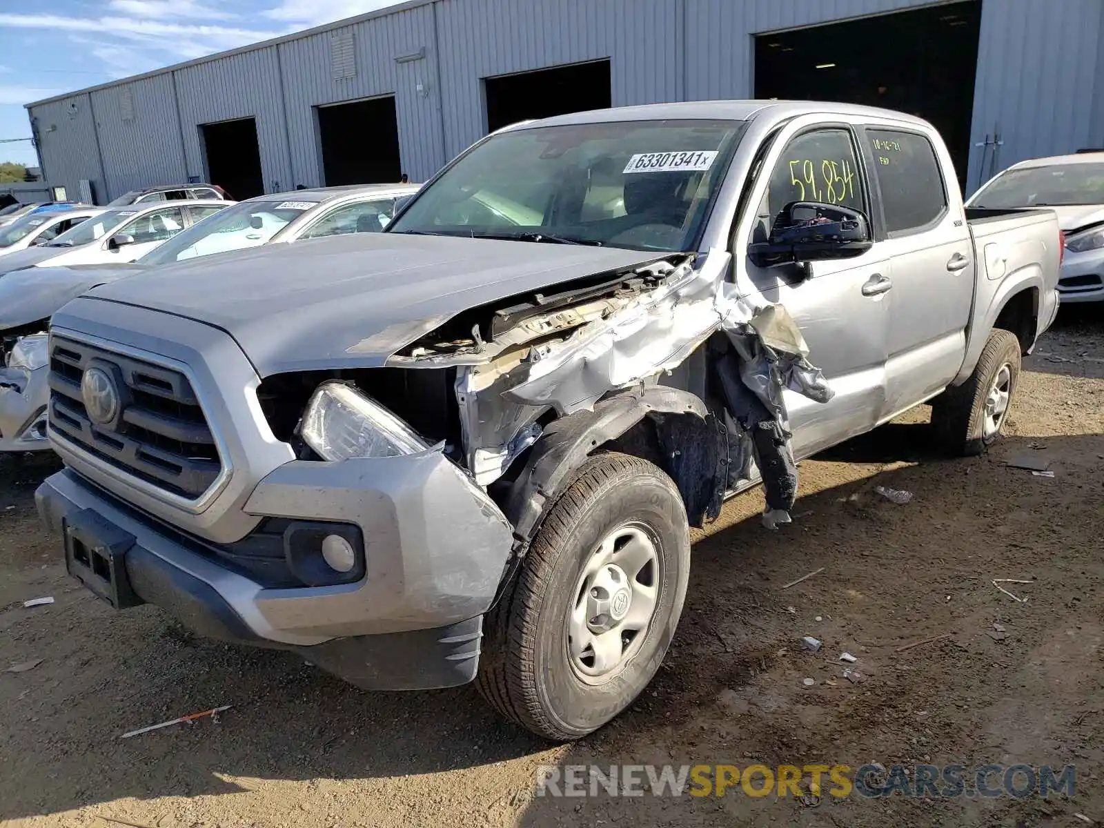 2 Photograph of a damaged car 5TFAX5GNXKX161657 TOYOTA TACOMA 2019