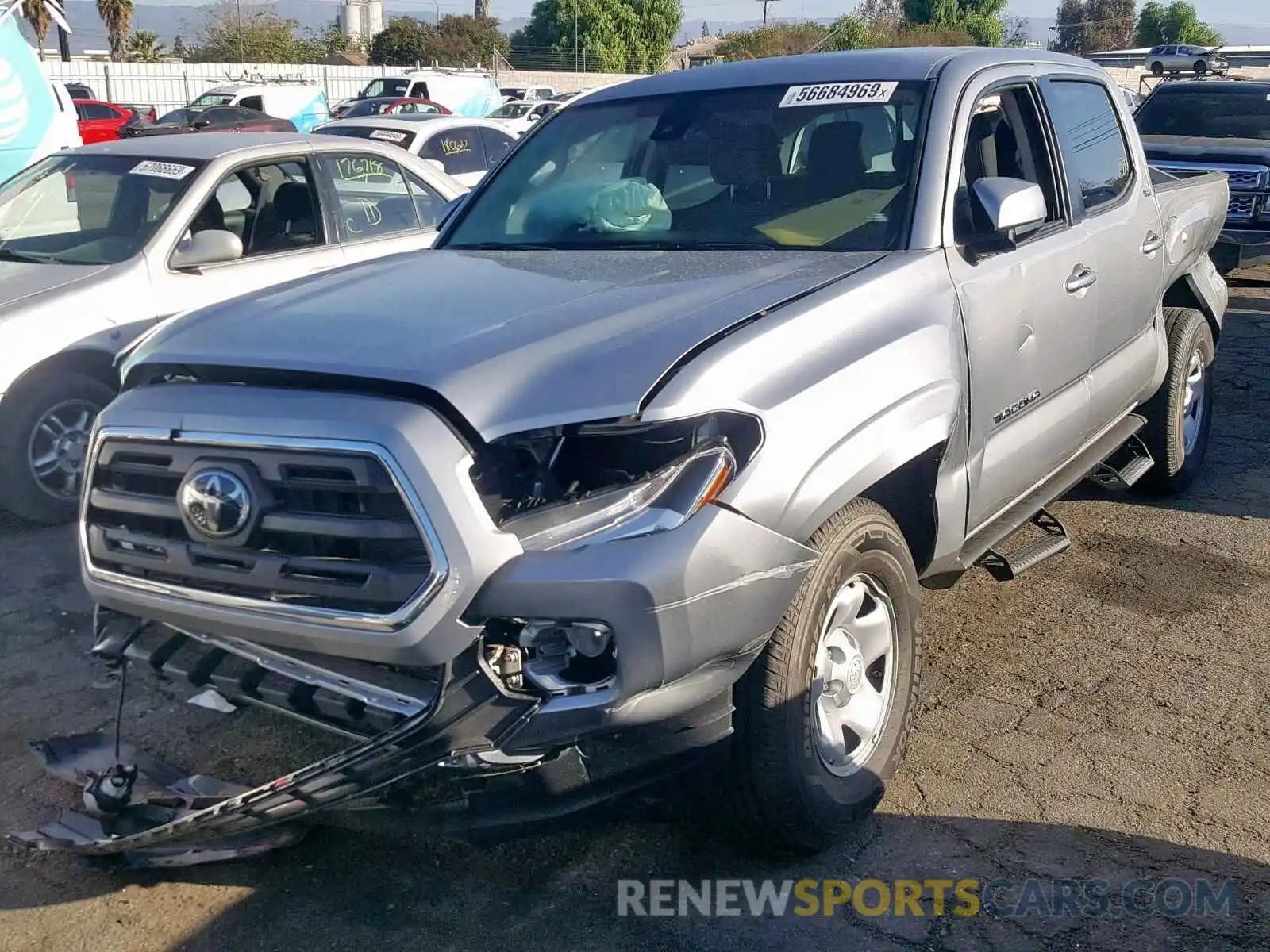 2 Photograph of a damaged car 5TFAX5GNXKX162565 TOYOTA TACOMA 2019