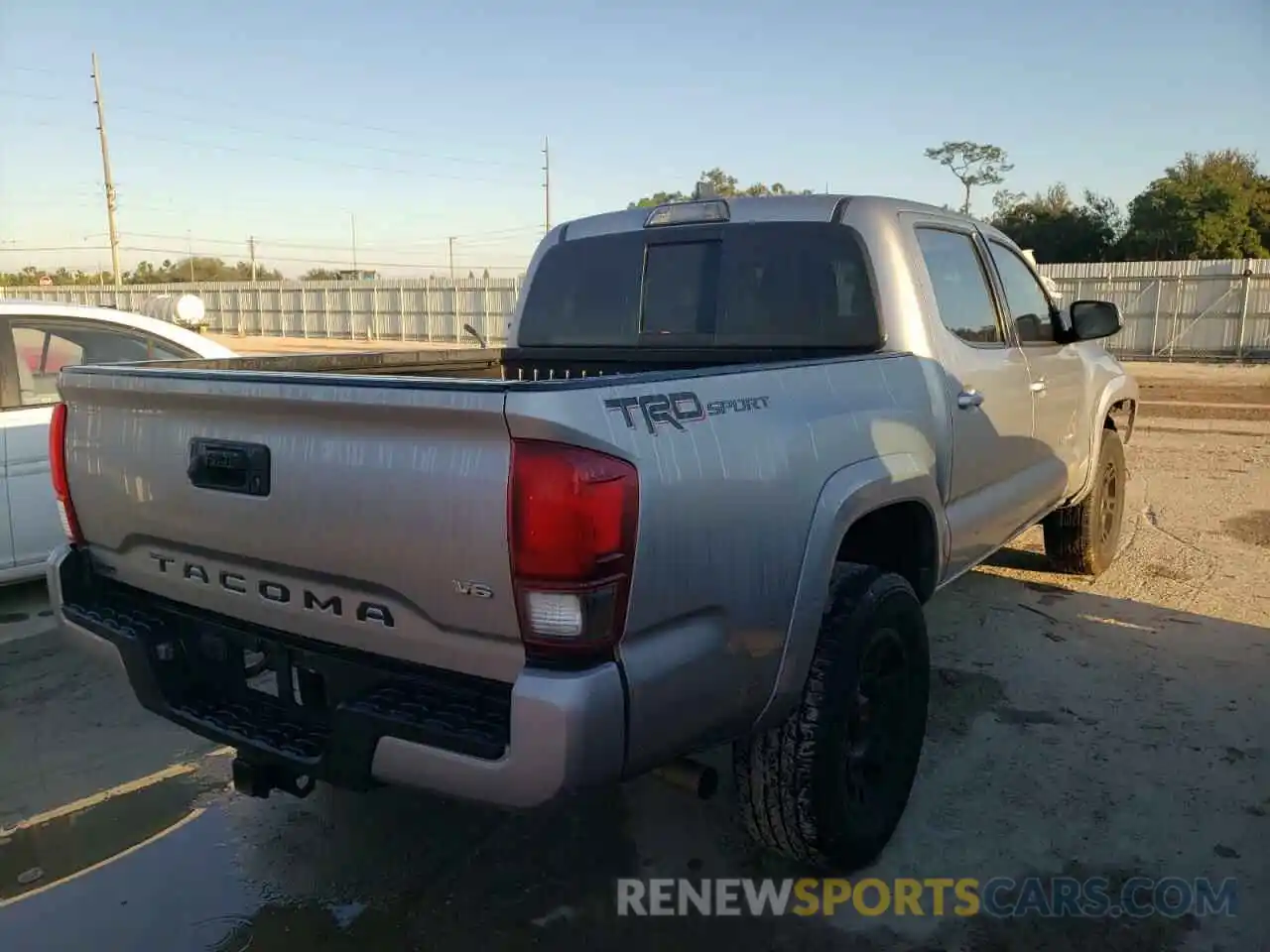 4 Photograph of a damaged car 5TFAZ5CN1KX077615 TOYOTA TACOMA 2019