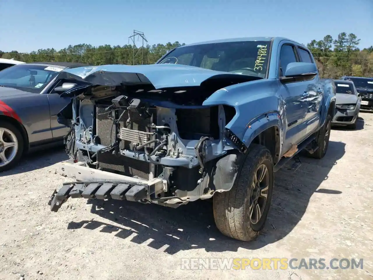 2 Photograph of a damaged car 5TFAZ5CN1KX085679 TOYOTA TACOMA 2019