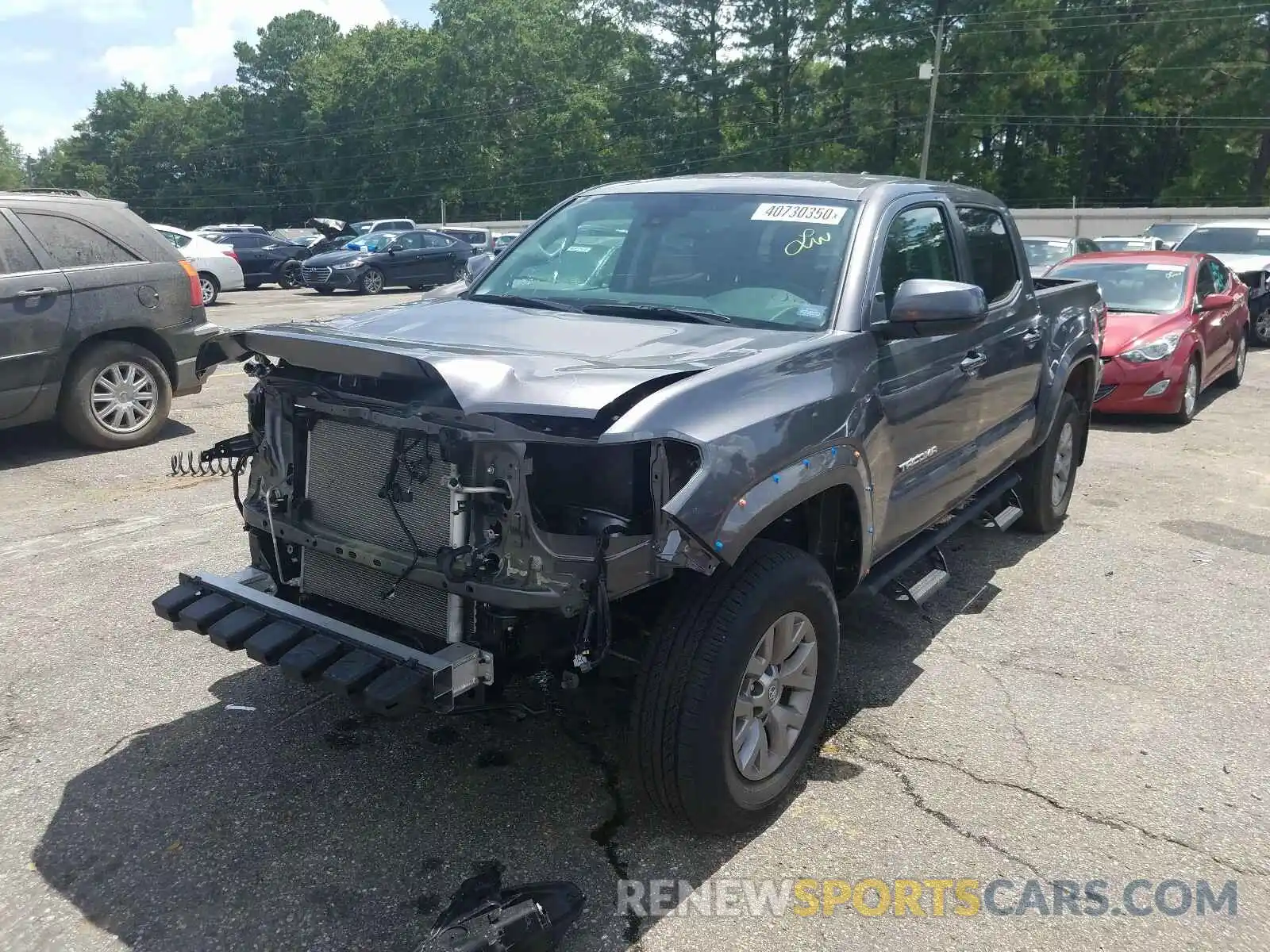 2 Photograph of a damaged car 5TFAZ5CN2KX085593 TOYOTA TACOMA 2019