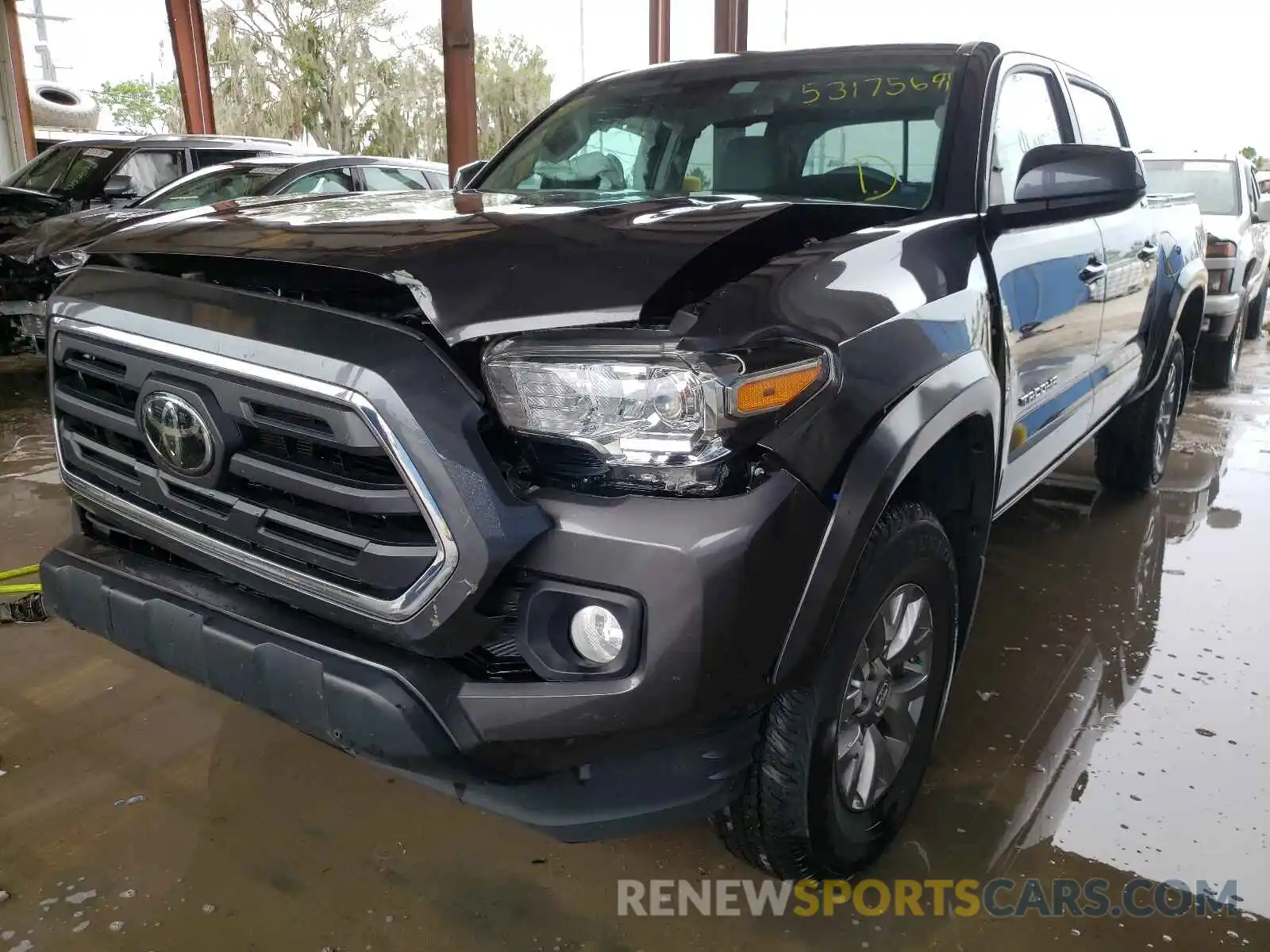 2 Photograph of a damaged car 5TFAZ5CN4KX076023 TOYOTA TACOMA 2019