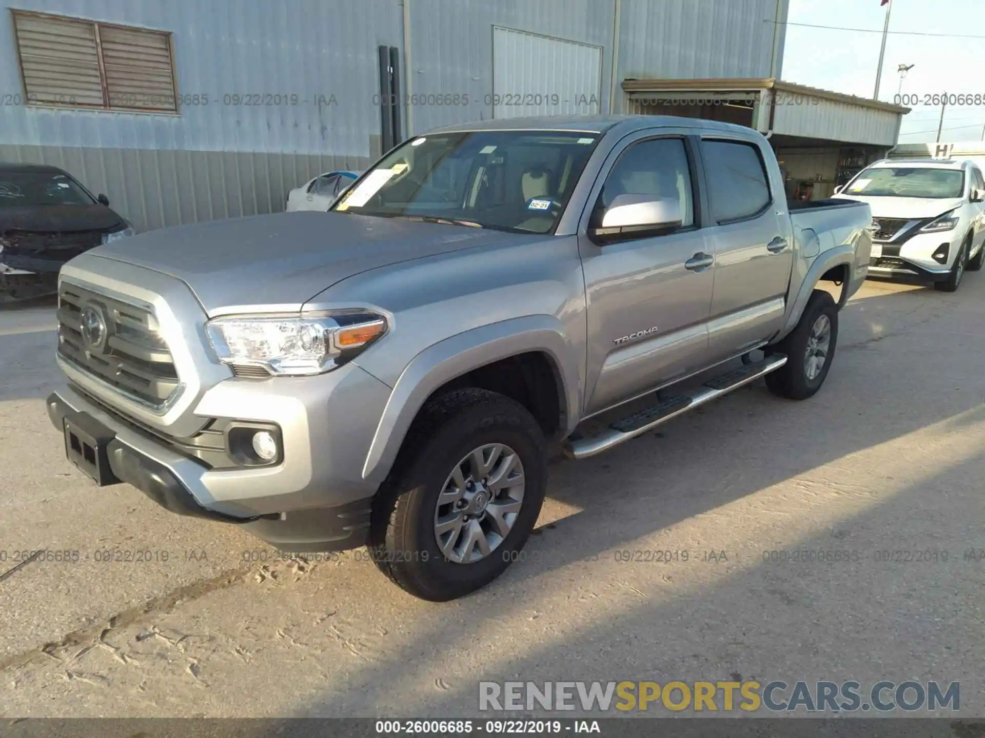 2 Photograph of a damaged car 5TFAZ5CN6KX073477 TOYOTA TACOMA 2019