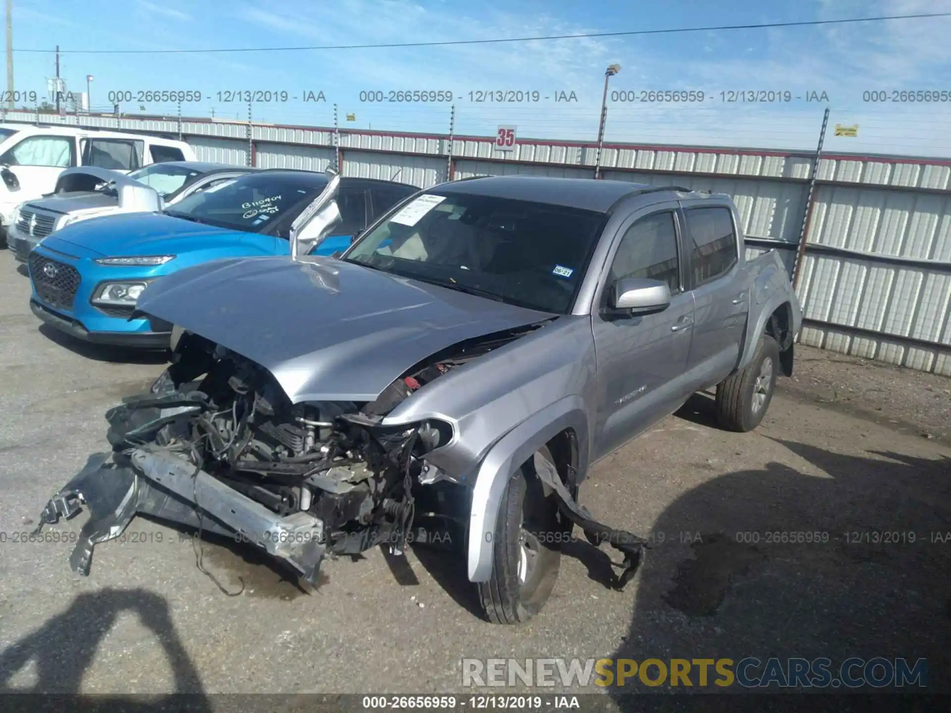 2 Photograph of a damaged car 5TFAZ5CN6KX082261 TOYOTA TACOMA 2019