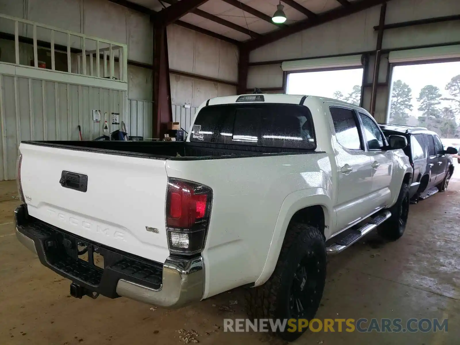 4 Photograph of a damaged car 5TFAZ5CN8KX077448 TOYOTA TACOMA 2019