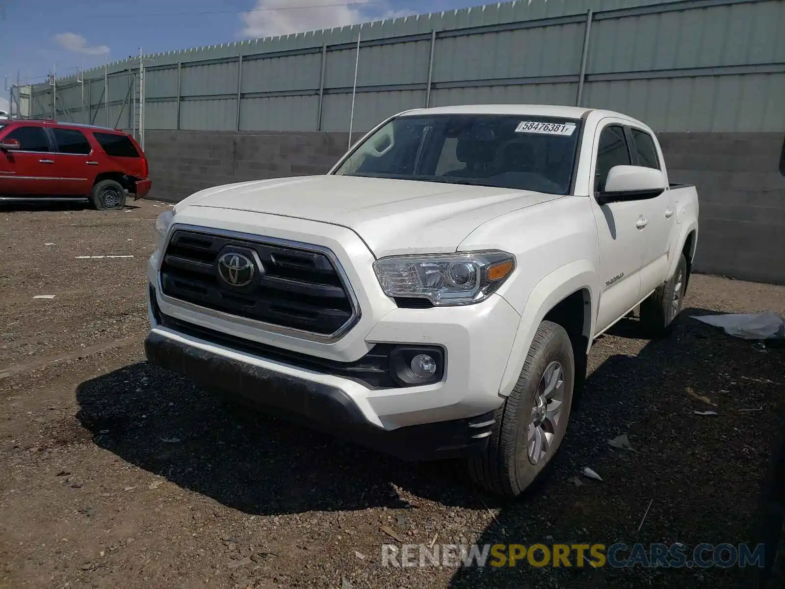 2 Photograph of a damaged car 5TFAZ5CN8KX077756 TOYOTA TACOMA 2019