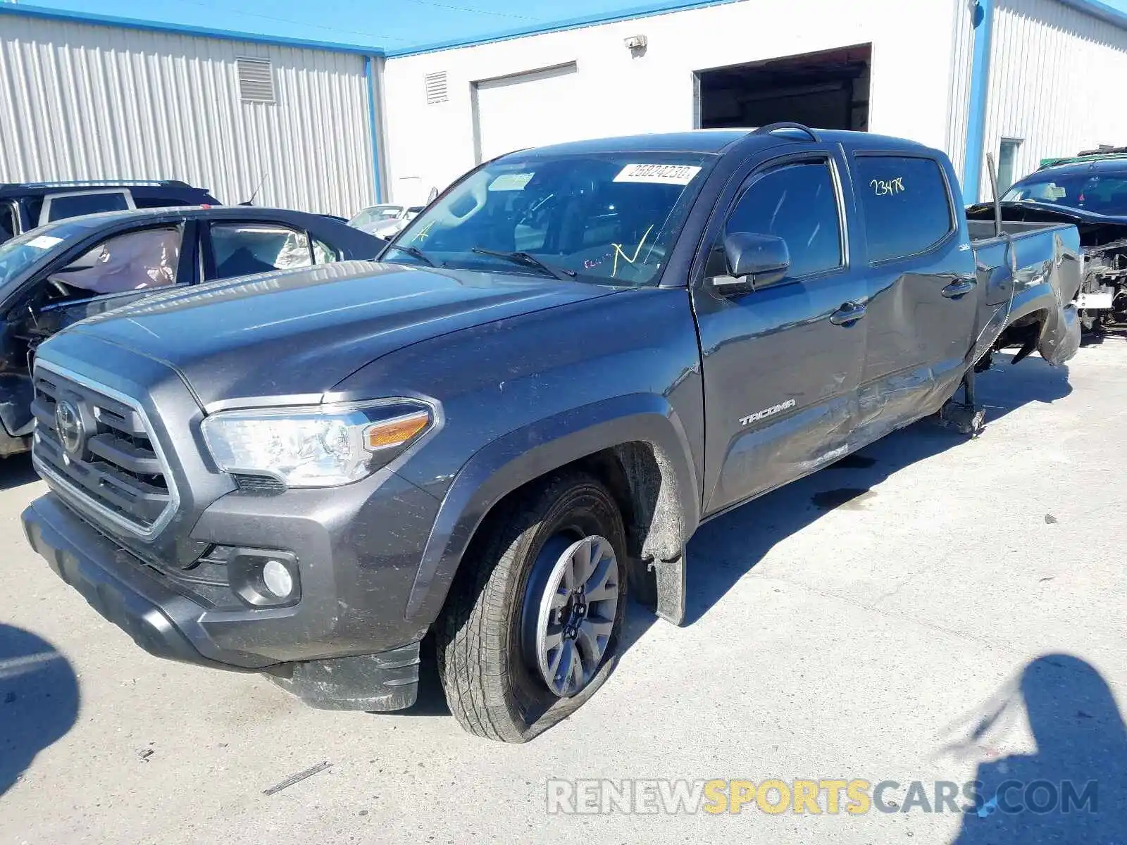 2 Photograph of a damaged car 5TFAZ5CN8KX079488 TOYOTA TACOMA 2019