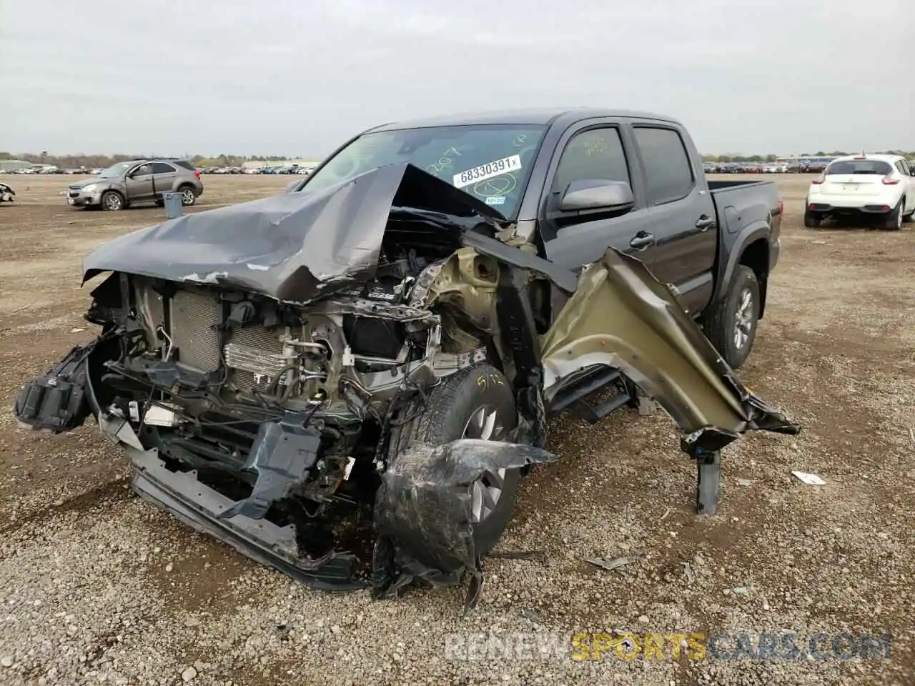 2 Photograph of a damaged car 5TFAZ5CN9KX086207 TOYOTA TACOMA 2019