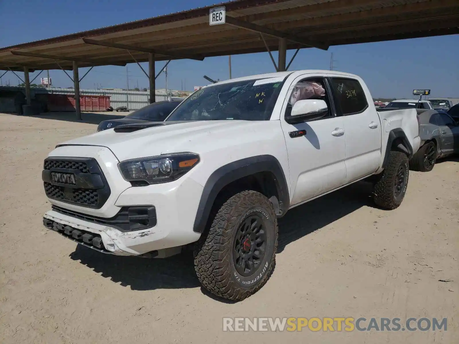 2 Photograph of a damaged car 5TFCZ5AN0KX174459 TOYOTA TACOMA 2019