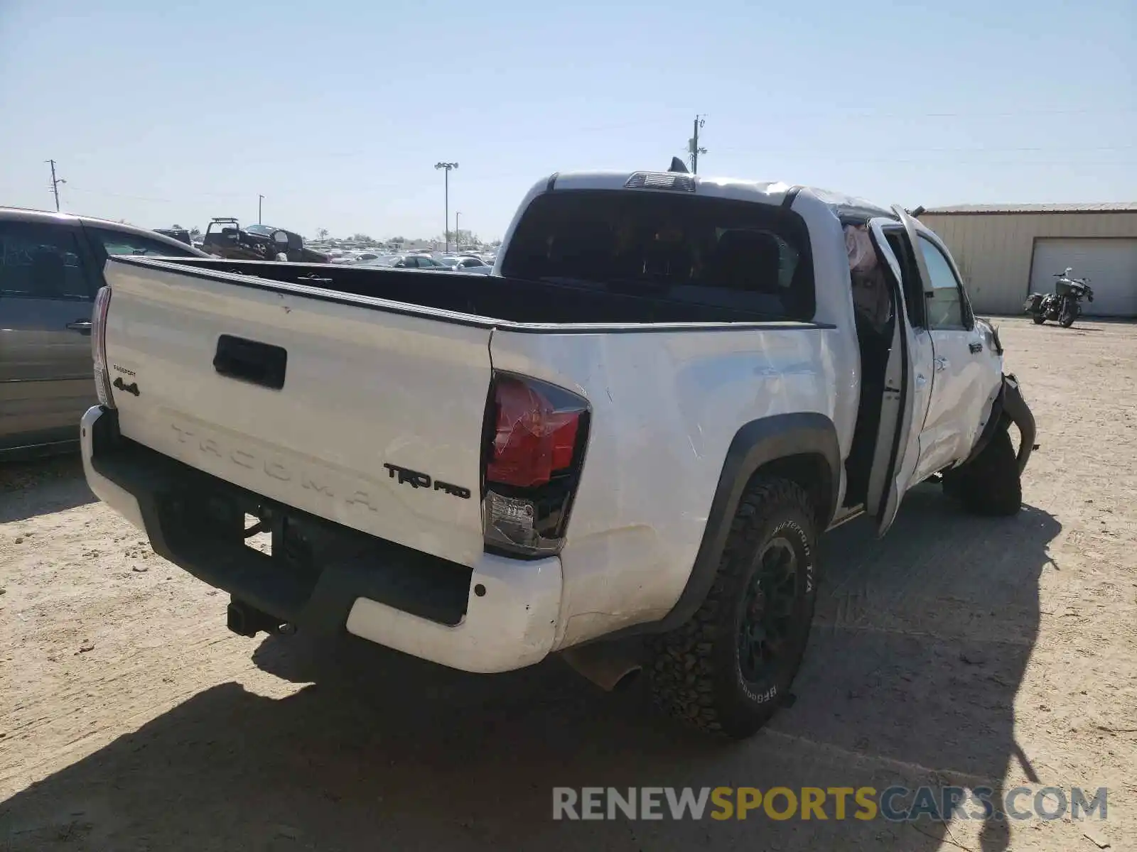 4 Photograph of a damaged car 5TFCZ5AN0KX174459 TOYOTA TACOMA 2019