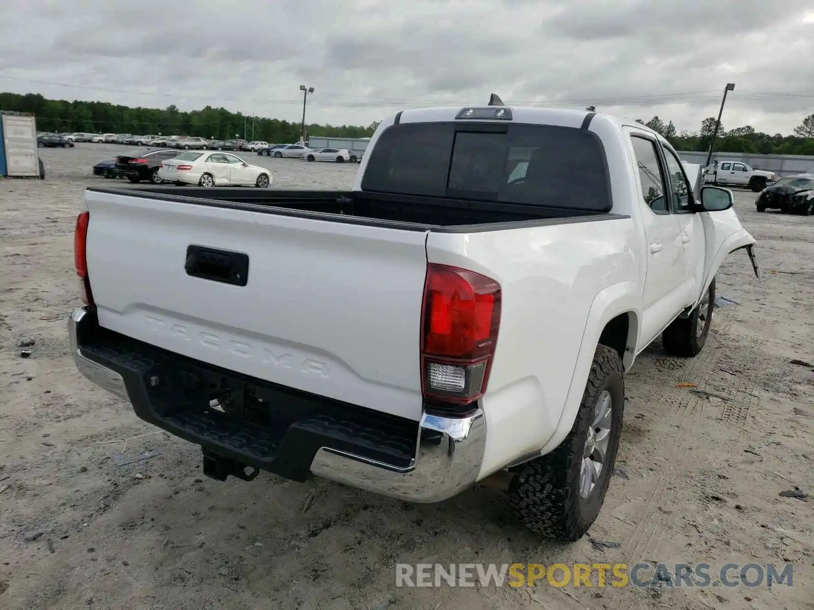 4 Photograph of a damaged car 5TFCZ5AN0KX186997 TOYOTA TACOMA 2019