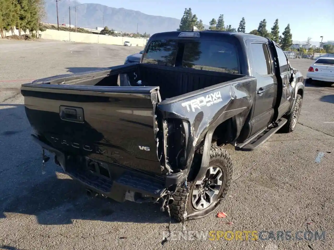 4 Photograph of a damaged car 5TFCZ5AN0KX189348 TOYOTA TACOMA 2019