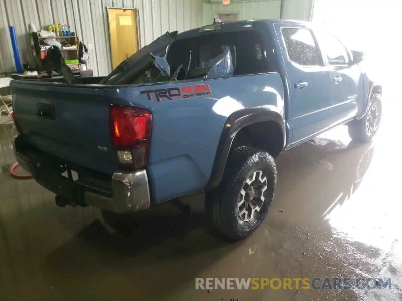 4 Photograph of a damaged car 5TFCZ5AN0KX200879 TOYOTA TACOMA 2019