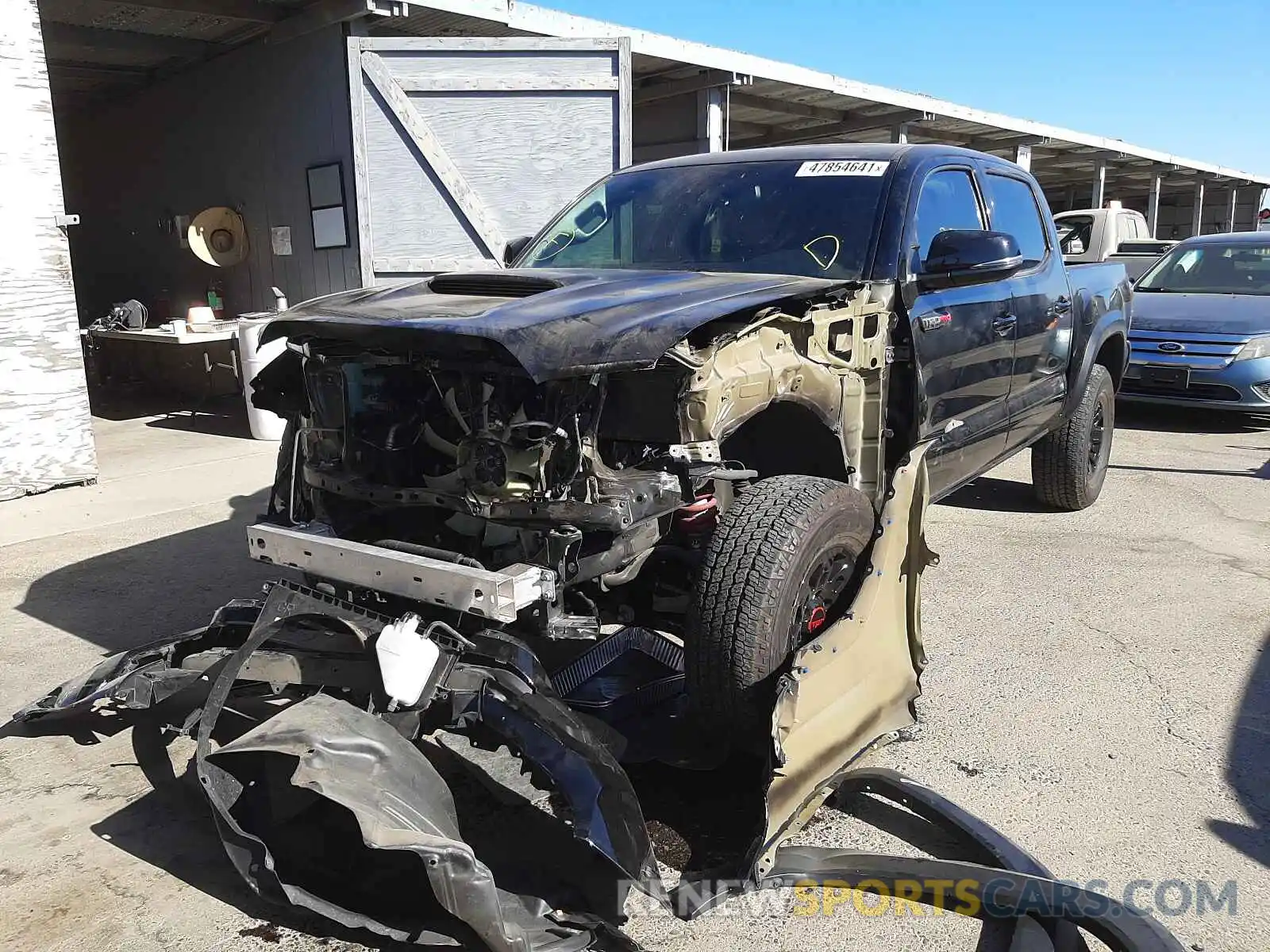 2 Photograph of a damaged car 5TFCZ5AN0KX209789 TOYOTA TACOMA 2019