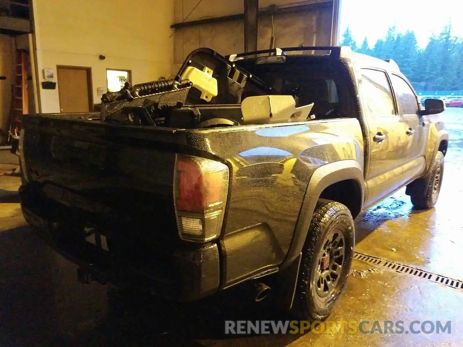 4 Photograph of a damaged car 5TFCZ5AN1KX194462 TOYOTA TACOMA 2019