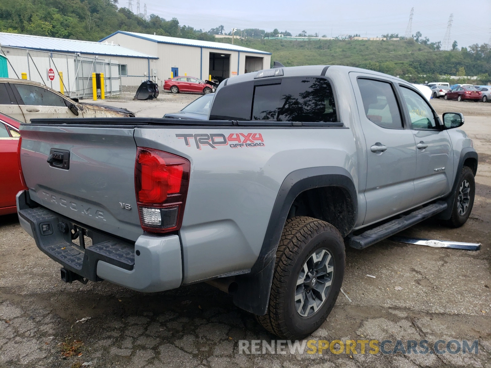 4 Photograph of a damaged car 5TFCZ5AN2KX180974 TOYOTA TACOMA 2019